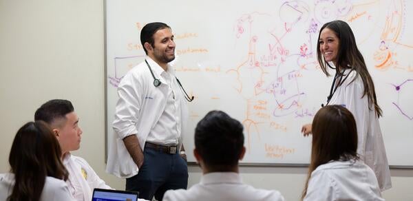 students at a white board